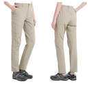 Pantalón femenino impermeable,
cintura con elástico en los laterales, beige.