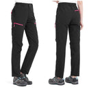 Pantalón femenino impermeable,
cintura con elástico en los laterales, negro.