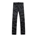 Pantalón impermeable convertible en bermuda, cintura elástica con ajuste, negro.