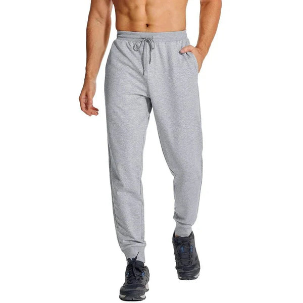 Pantalón masculino deportivo con tejido Quick Dry que elimina la humedad, manteniéndote seco durante entrenamientos intensos, Gris Claro.
