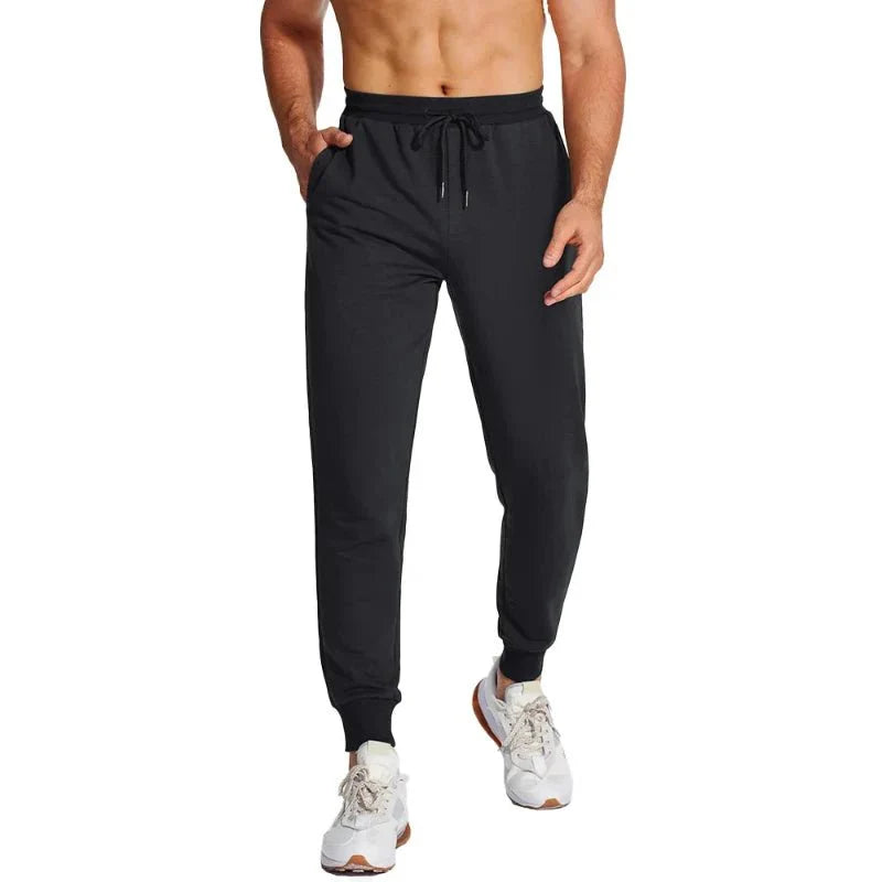 Pantalón masculino deportivo con tejido Quick Dry que elimina la humedad, manteniéndote seco durante entrenamientos intensos, negro.