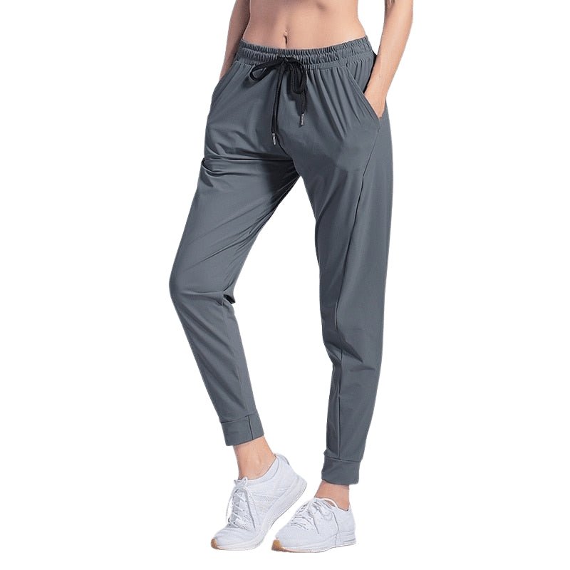 Pantalones de mujer súper confort.
Modelo con tira al tobillo acanalada - Gris