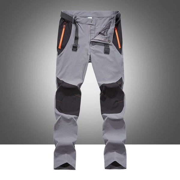 Pantalones ligeros de hombre recortes que garantizan flexibilidad de movimiento, color gris