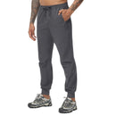 Pantalón de hombre con cinturilla elástica tejido 92% poliéster 8% elastano, color gris oscuro
