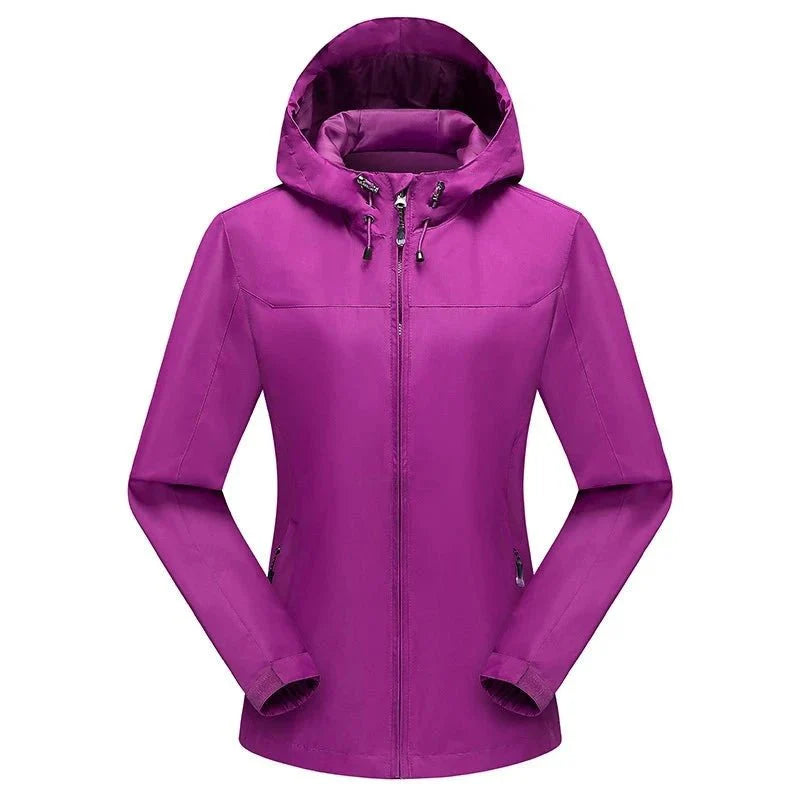 Chaqueta cortavientos para mujer con forro.
Resistente al agua y al viento e capucha con cordón, bolsillos para las manos con cremallera, lila.