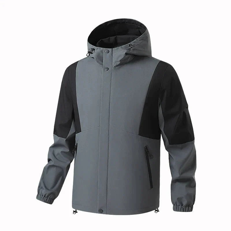 Chaqueta cortavientos deportiva para hombre, gris.
Capucha con cordón ajustable, bolsillos para las manos con cremallera.